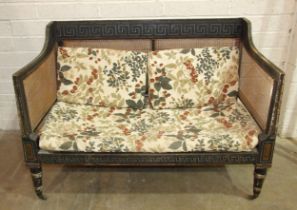 A Regency caned Bergère settee with painted frame, on removeable turned legs with castors, 129cm