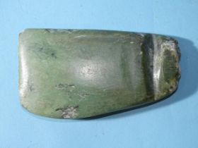 A carved green hardstone axe head, 12.5 x 7 x 1.5cm.