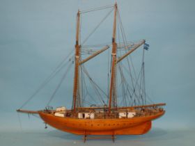 A scratch-built model of a two-masted ketch rig boat, the planked hull with rigging and deck