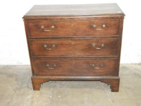 An antique oak chest of three long drawers, on bracket feet, 95cm wide, 88cm high, 46cm deep.