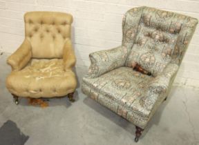 A Victorian button-back low deep-seated salon chair with rolled back and arms, on walnut legs with