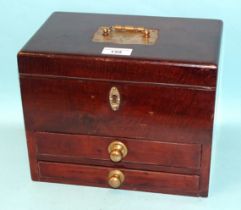 A mahogany box, the hinged lid fitted with a brass carrying handle and two base drawers, 27cm