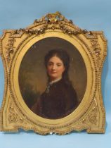 Circle of Richard Buckner PORTRAIT OF A YOUNG LADY Oil on panel, framed oval, 33 x 28cm.