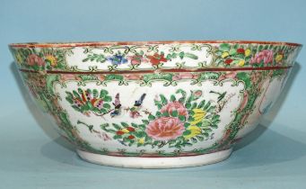 A 19th century Canton bowl, typically-decorated with panels of figures, birds and flowers, 26cm