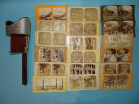 An Underwood & Underwood aluminium stereoscope viewer with 56 stereocards by Webster & Albee,