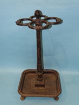 A Victorian cast iron stick/umbrella stand, the square drip tray with tab feet and gadrooned border,