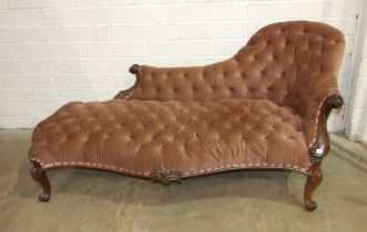A Victorian rosewood single-ended chaise longue, the carved frame, upholstered button-back and