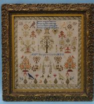 A 19th century needlework sampler by Margaret Smyth, having a rhyme above an arrangement of trees,