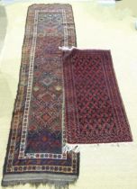 An Oriental corridor carpet, the central field with diamond lozenges on a dark brown ground,