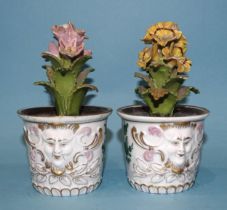 A pair of Continental, 'red anchor' flowerpot ornaments, each floral spray within a planter