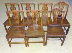 A harlequin set of seven oak country Chippendale-style dining chairs, (7).