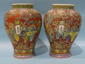 A pair of modern Chinese baluster clobbered vases decorated with numerous figures in a landscape and