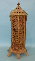 A Victorian cast metal pagoda-form hexagonal burner or heater, cast decorated with architectural