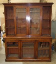 A Victorian mahogany library bookcase, the moulded cornice above a pair of plain-glazed doors