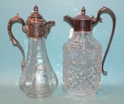 A glass claret jug with etched leaf decoration and plated mount, with hinged lid, shaped handle