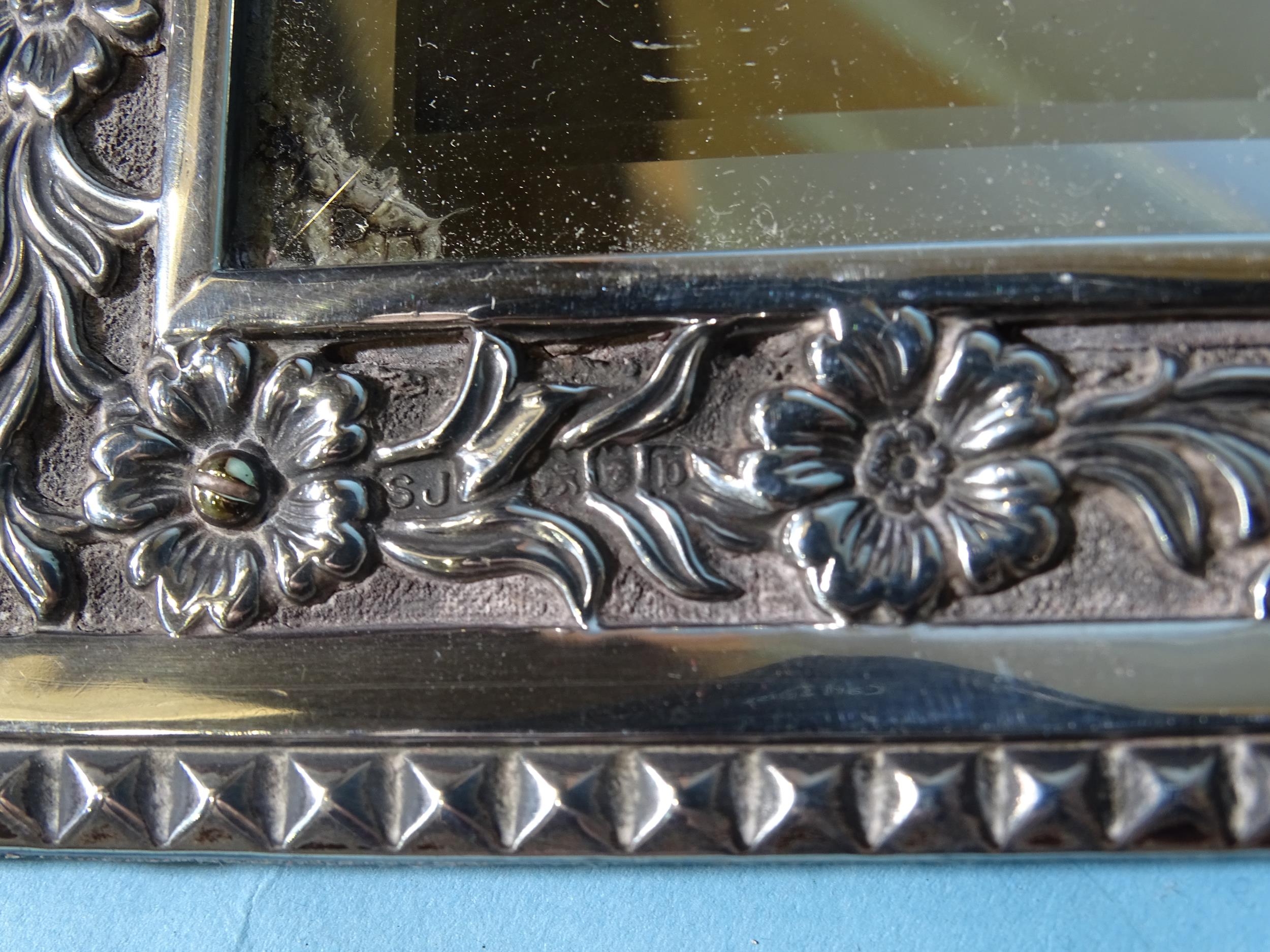 A late Victorian silver framed rectangular wall mirror, the border with embossed floral - Image 2 of 3
