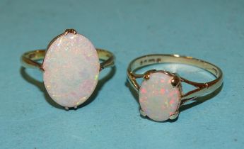 A 14k gold ring set opal, size K, 1.5g and another, 9ct gold example, size L, 1.3g, (2).