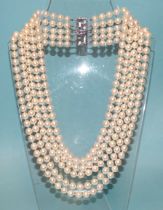 A late-20th century necklace of five strands of uniform cultured pearls, with white gold pearl-set