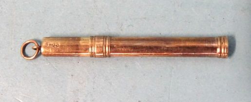 A 9ct gold retractable toothpick, 50mm (closed), 2.4g.