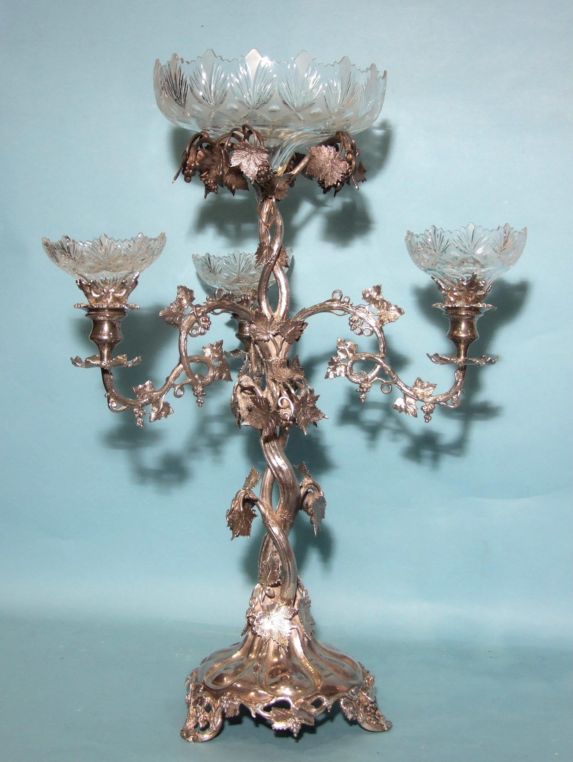 A large Victorian plated centrepiece in the form of a fruiting vine, with central glass bowl and