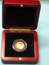 A George V 1918 sovereign, Bombay Mint, in capsule and case.