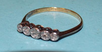 A five-stone diamond ring illusion-set 8/8-cut diamonds, in 18ct gold, size O, 1.6g.