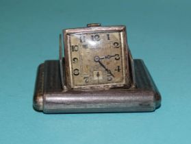 Tavannes, a silver Art Deco purse watch with hinged divided doors enclosing a hinged square watch