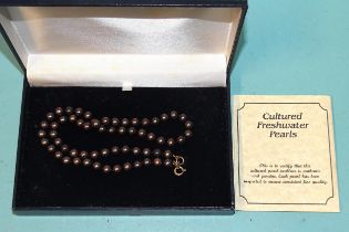 A single-strand black pearl necklace of 6.5mm uniformly-sized cultured pearls, with certificate, (