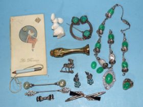 A white metal Celtic penannular brooch set green hardstones and a small quantity of costume