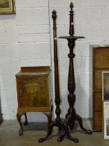 Two carved mahogany tripod standard lamps, a walnut bedside table and a mahogany dining suite, (4).