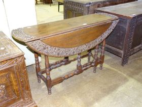 A carved hardwood gate-leg table, 113 x 78cm open and a carved oak blanket chest, 107cm x 52cm, (2).