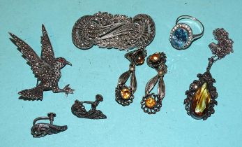 A marcasite-set dress clip/brooch, a marcasite-set crow brooch, a silver ring set blue spinel, a