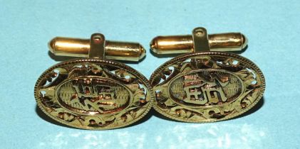 A pair of yellow gold cufflinks with incised Chinese characters, marked "14k", 7.3g.
