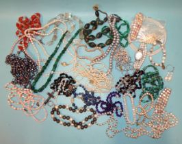 A large quantity of bead necklaces, including amethyst, lapis lazuli, malachite, coral and