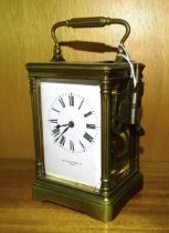 A French brass carriage clock striking on a gong, retailed by Sir John Bennett Ltd, Paris, no.