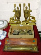 A pair of brass urn-shaped fire dogs, (incomplete), a brass rolling ruler by J Halden & Co. Ltd,