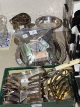 A small collection of plated ware, including a pierced bottle holder, toast racks, cutlery, etc,