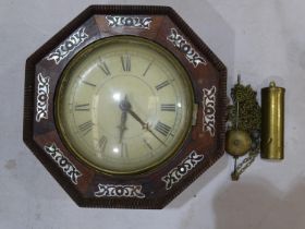 An octagonal rosewood-cased wall clock, inlaid with mother-of-pearl, 23 x 24cm.