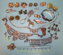 A pair of Orena ear clips and matching brooch, a paste pendant on spectacle-mounted paste chain,