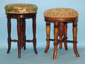 Two hardwood revolving piano stools, each with circular upholstered seat, on turned splayed legs, (