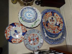 An early-19th century Chinese Imari plate with typical flower head and underglaze blue decoration,