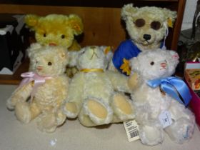 A collection of five modern Steiff bears: 'The Millennium Bear', 'The 2001 Bear', 'Charlotte, The