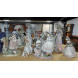 Eleven Lladro figures and figural groups to include a girl standing under a lamp post,