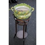 Edwardian style jardiniere stand, 67cm high, together with a green glazed pottery twin handled pot