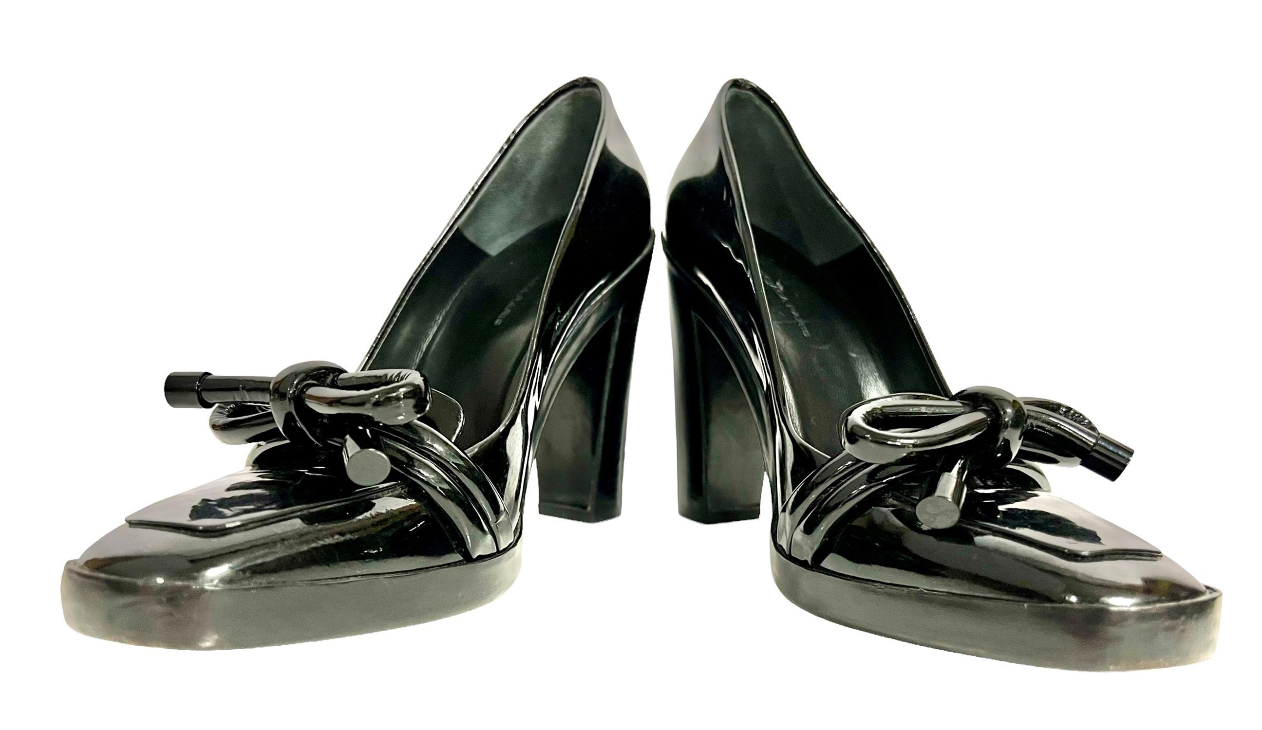 A pair of ladies BALENCIAGA PARIS black patent leather platform high block-heeled loafer style