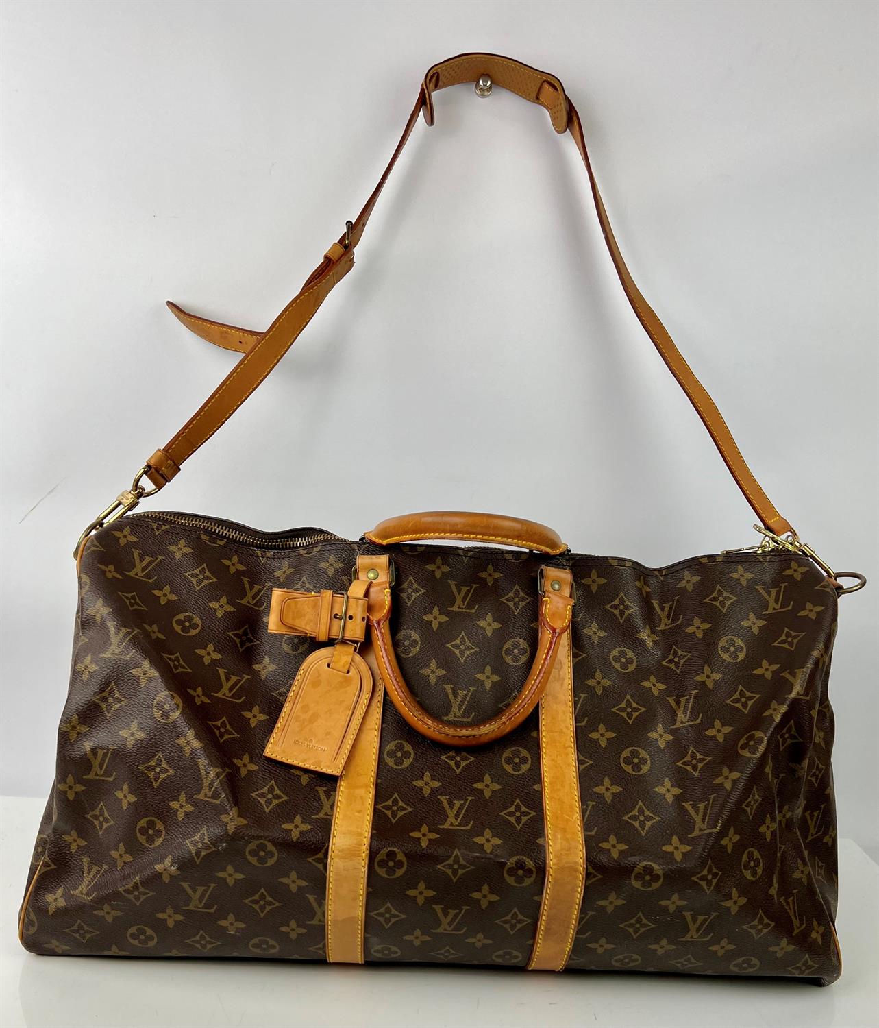 LOUIS VUITTON Monogram Keepall Bandouliere 60 Boston Travel bag with long strap and luggage tag.