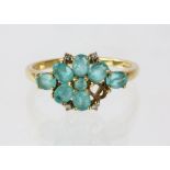 9ct floral ring set with blue stones and four small diamonds, size P, 2.2 grams