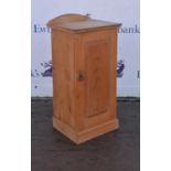 A pine pot cupboard, panel door with shelf to interior raised on plinth base. 38.