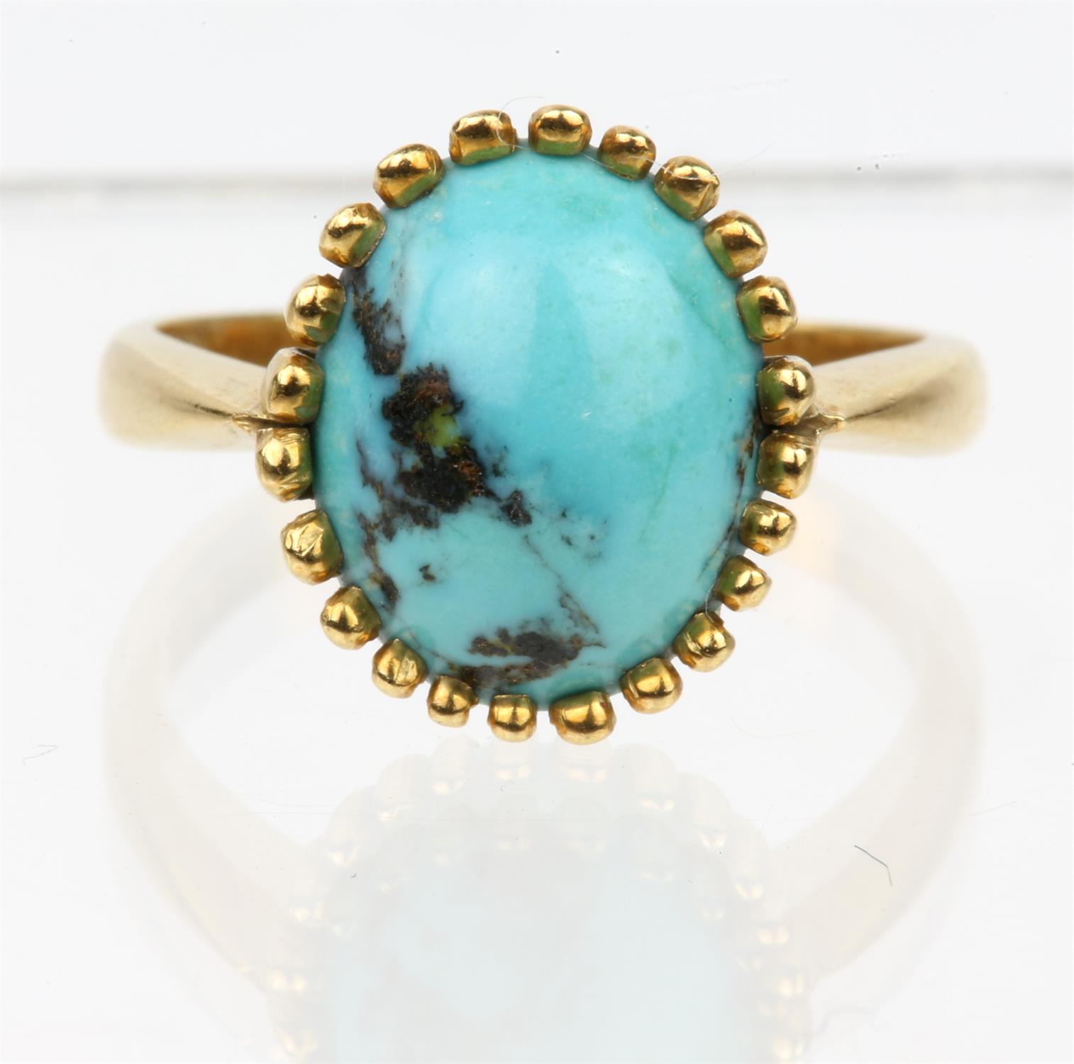 A single stone turquoise ring, in yellow metal stamped 18ct, ring size M