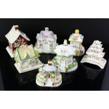 Twenty two Coalport giftware models of buildings including Church, Mill house etc.